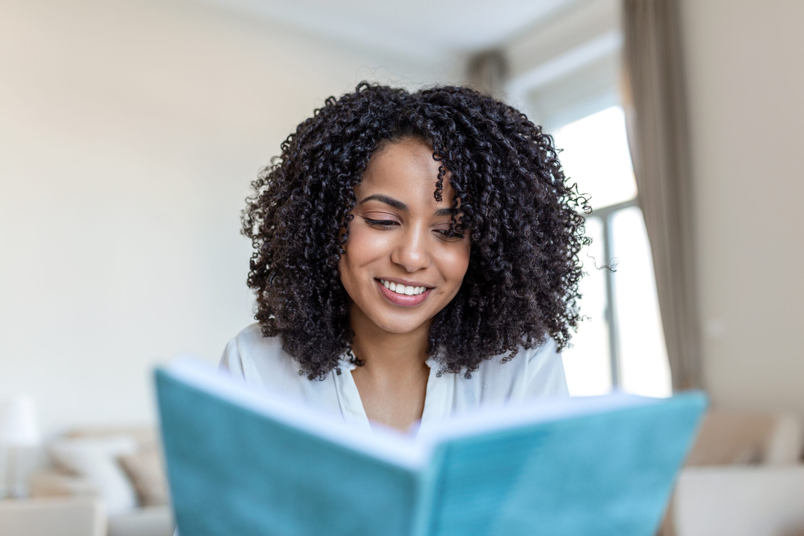 Young,Beautiful,African,American,Woman,Holding,Book,,University,Student,Studying,