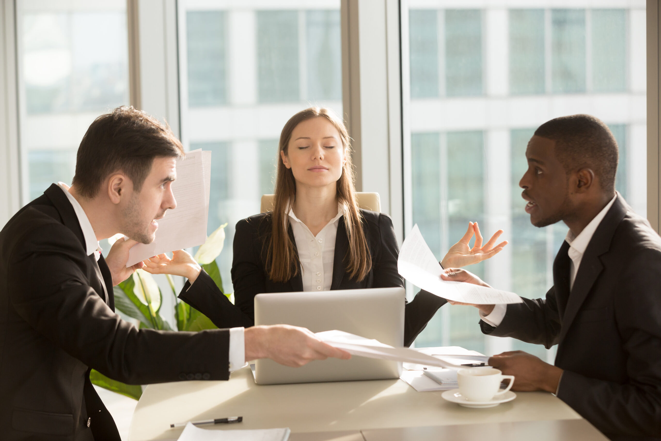 Attractive,Businesswoman,Enjoys,Meditating,During,Meeting,,Sitting,At,Office,Desk