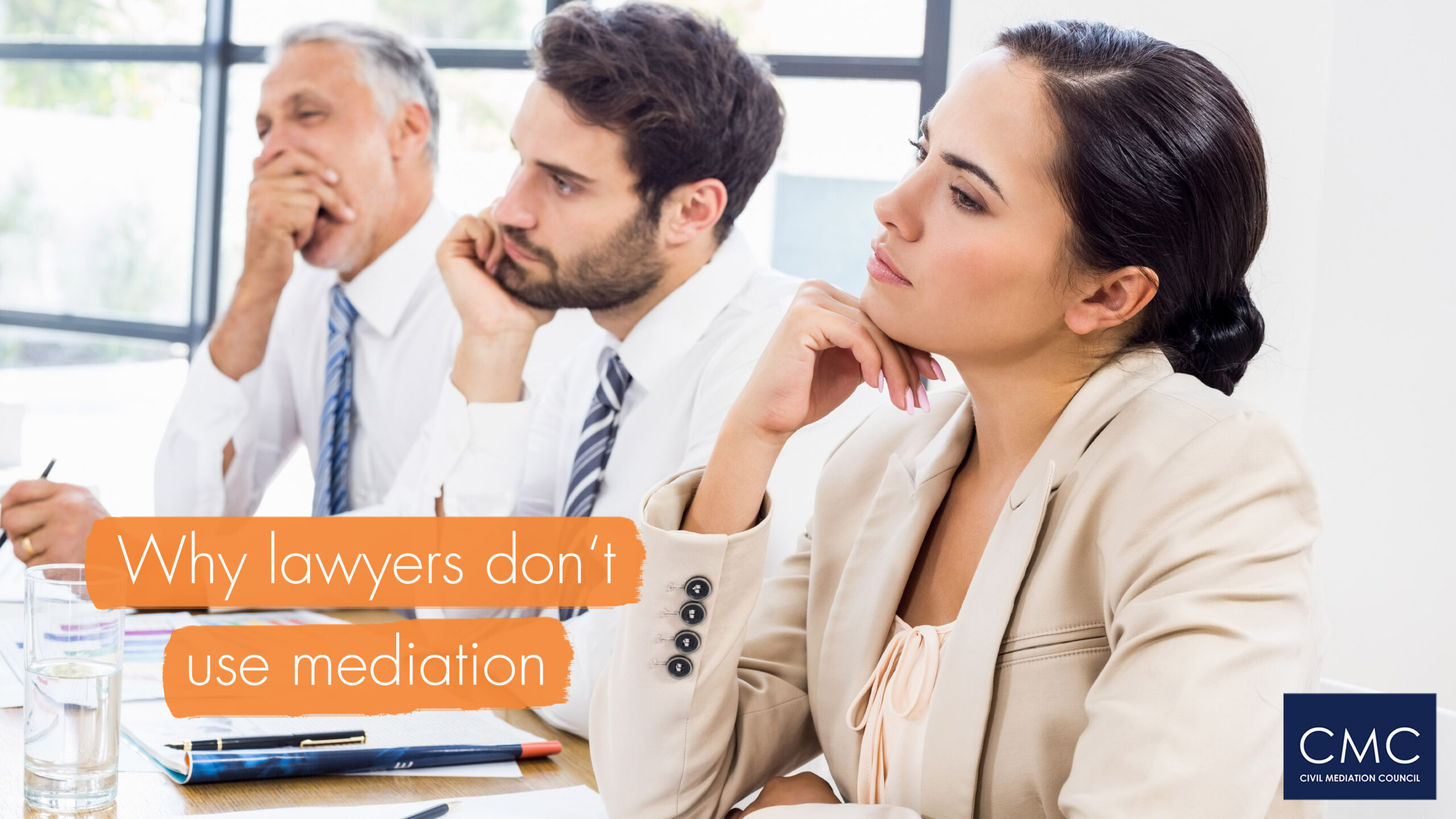 Three people at desk in a row looking critical and a little bored