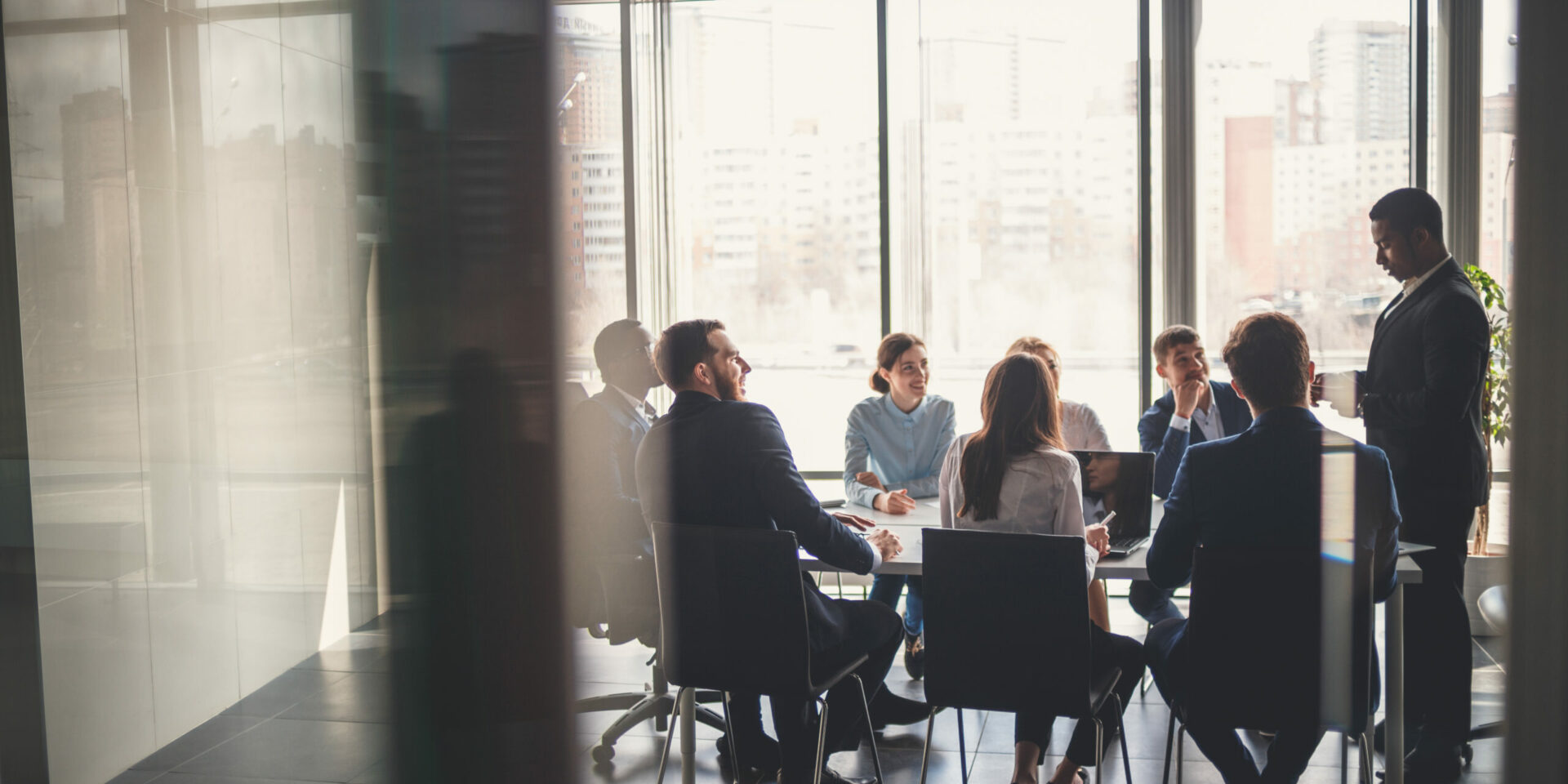 Group of people in board room having a discussion