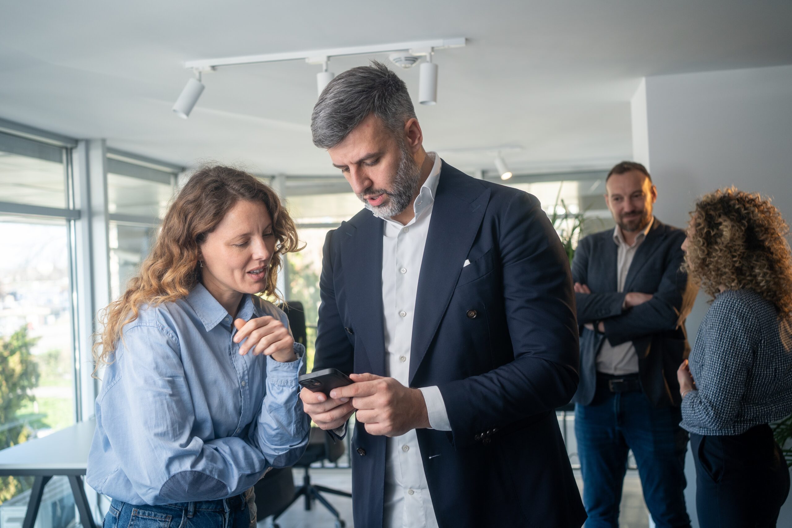 Colleagues,Man,And,Woman,Chatting,And,Networking,During,Conference,Break