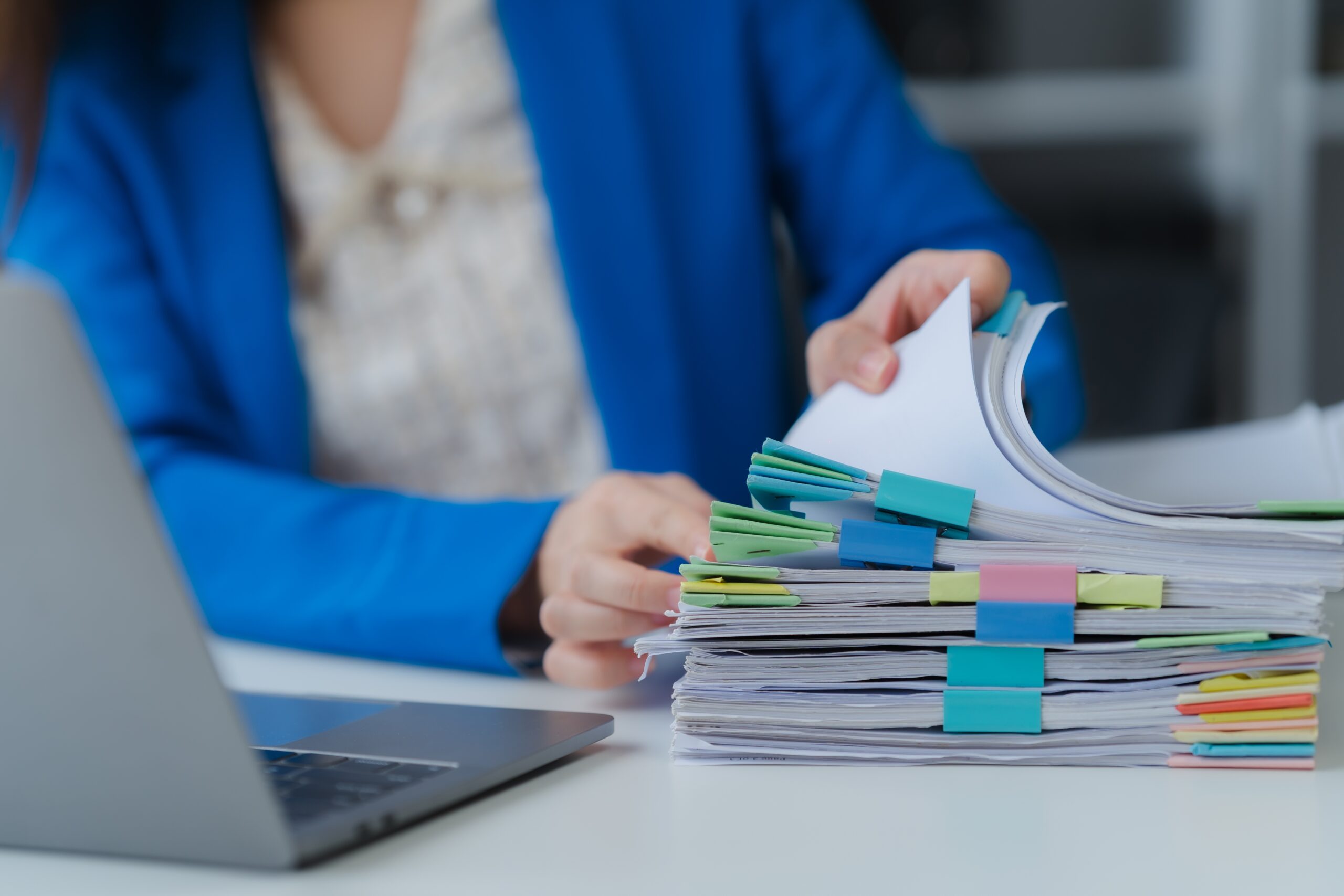 Woman,Organizing,Documents,At,Desk